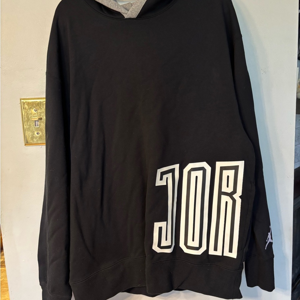 Black JORDAN Hoodie with Bold White 'JORDAN' Graphic